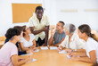 © JackF - Positive group of different aged multiracial people attending foreign language course.
