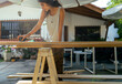 © Luis Herrera/Stocksy - woman DIY sanding machine