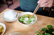 © Studio KME/Stocksy - Fresh Noodles and Herbs in Vietnamese Broth