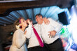 © Alvaro Lavin/Stocksy - Guests singing karaoke and having fun at wedding party