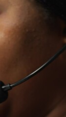 Poster - vertical video closeup of call center employee talks in headphones mic, handling customer inquiries 