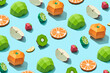 © Yaroslav Danylchenko/Stocksy - Handmade fruits origami pattern on blue