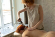 © Anna Artemenko/Stocksy - massage therapist puts cups on the patient's back