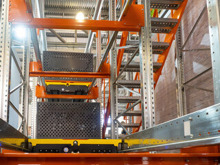 Poster - Automated warehouse rack. Platform for lifting loads is built into warehouse furniture. Technologies for storage automation. Automated warehouse equipment. Multi-tier racking with automated platform