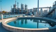 © miss irine - Modern water treatment plant cleans industrial wastewater. Purification tanks, processing reservoirs purify sewage water with industrial technology. Sustainable eco-friendly factory environment.