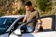 © Christine La/Stocksy - Driver getting into car