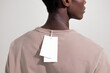 © Artem Podrez/Stocksy - White Apparel Tags Hanging on Back