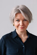 © Viktor Solomin/Stocksy - Portrait of a woman with short gray hair