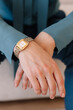 © Viktor Solomin/Stocksy - Elegant wristwatch adorns a hand in a stylish indoor setting