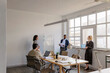 © BONNINSTUDIO/Stocksy - Entrepreneurs brainstorming and discussing new project at office