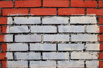 Aufkleber - A red and white brick wall with a white border, ideal for use in design projects requiring a bold and contrasting element.