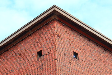 Aufkleber - A historic-style building with a prominent clock on its exterior wall, perfect for use in historical or nostalgic-themed projects.