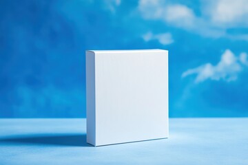 Aufkleber - Minimalist white box displayed against a serene blue backdrop with soft clouds in the background during daylight
