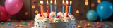 Festive cake adorned with candles, balloons, and candy decorations, bakery, colorful