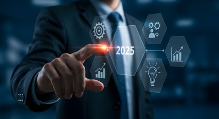 Poster - Businessman Touching Holographic Screen Displaying 2025 and Business Strategy Icons in Dark Blue Background