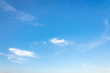 Wall Mural - nature backdrop with blue sky and white fluffy clouds in morning light. bright and sunny weather for