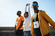 © Jacob Lund - Athletes preparing for a race with stretching exercises