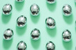 © sunaiart - Disco Ball Easter Eggs - Silver Reflective Pattern on Pastel Green Background, Pop Art Minimalist Style for Holiday Branding (AI Generated)