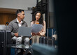 © Meeko Media - Business Professionals Collaborating in a Hotel Lobby with Luggage