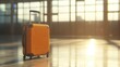 © Chaweewan - Travel-ready suitcase standing alone, blurred airport windows with soft natural light streaming in.