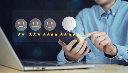 Wall Mural - Customer satisfaction survey concept, Businessman using smartphone touch happy smiley icon, 5 star service experience rating, Feedback, Online review