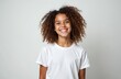 © Maryna - Portrait of smiling pretty schoolgirl. Joyful preteen girl with curly hair, white background. Black female child with happy face. Beauty, skincare, healthy teeth concept. Positive emotions, joy.