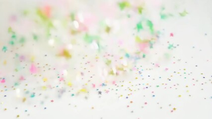 Poster - A white background with a lot of stars. The stars are in different colors and sizes. The stars are scattered all over the background