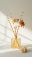 Poster - soft light illuminates an elegant vase with dried flowers and reeds against a serene background