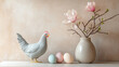 © romagumy - Decorative arrangement featuring a chicken and pastel eggs alongside floral branches in a serene indoor setting