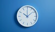 © ABD Miah - Simple White Clock on Blue Wall, Minimalist clock design, time management concept