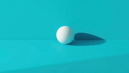 Leinwandbilder - White sphere casting a soft shadow on a vibrant blue surface creates a striking visual contrast in a minimalist setting