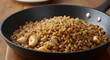 © Muhammad - Delicious roasted farro grain dish with garlic cloves and onion in skillet