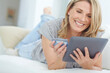 © peopleimages.com - Relax, credit card and happy woman with tablet in home for online shopping, digital banking or payment. Debit money, tech and finance for ecommerce, discount and bargain sale on sofa in living room