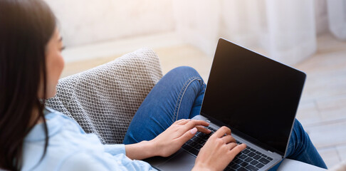 Poster - Mockup image of asian girl using laptop computer with blank screen at home, space for your design