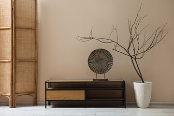 Poster - console table and decor near dark beige wall in room. interior design
