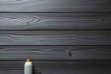 Poster - Minimalist close up of isolated cosmetics on a glossy dark wooden table against a gray background