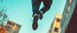 © Ai Studio - High action capture of a person leaping through the air against a backdrop of modern architecture, conveying energy and freedom in motion.