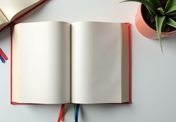 Poster - Open blank book on a table with a potted plant  