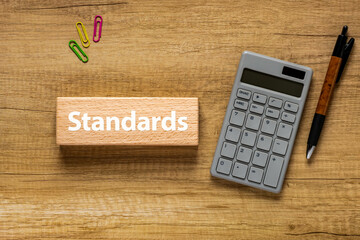 Poster - There is wood block with the word Standards. It is as an eye-catching image.