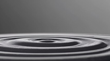 Poster - Gray liquid surface revealing expanding circular ripples after single drop falling, creating mesmerizing dynamic pattern with smooth wave propagation and elegant visual rhythm