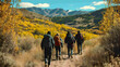 © Arief - A group of hikers trekking through a vibrant autumn landscape with mountains in the background.