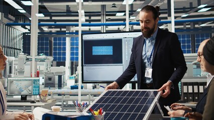 Poster - research and development team analyzes solar cell prototypes to optimize energy conversion rates. so