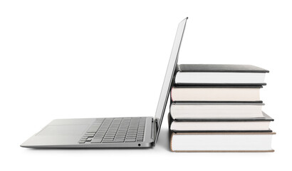 Closed hardcover books and laptop isolated on white
