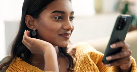 Aufkleber - Indian woman, connection and phone in home for reading, typing and text message on sofa in lounge. Girl, networking and mobile app for creating profile, chat and choice for match on dating website