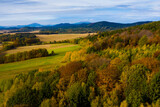 View from drone of natural landscape with autumn mixed woodlands on hillsides