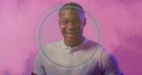 Poster - Man with face paint and circular animation design on pink background