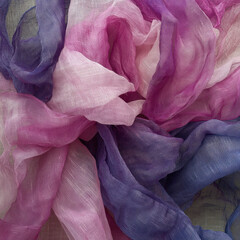 Poster - A purple and pink fabric is folded into a flower shape. The colors are vibrant and the texture is smooth