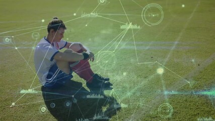 Poster - Soccer player sitting on field with digital data processing animation overlay