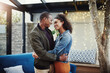 © peopleimages.com - Couple, smile and love with hug in backyard for support, connection and date on anniversary. Woman, man and happy with embrace on patio by fairy lights for marriage, commitment and summer romance