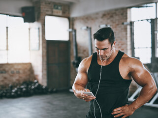 Aufkleber - Music, phone and bodybuilder man relax in gym for start of exercise, training or workout routine. Break, earphones and fitness with muscular person in health club for bodybuilding or streaming
